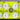 White golf balls with red and green printed logos arranged in a bright yellow plastic tray.